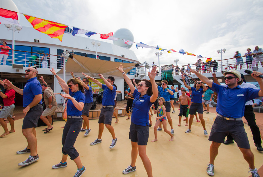 Fathom Travel crew and staff kicking off the cruise with a dance.